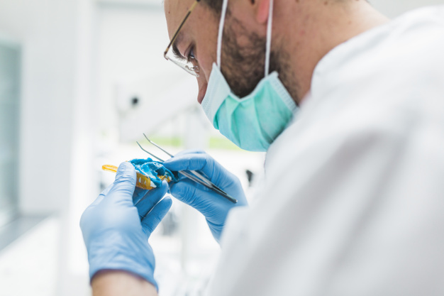 Dentist making impression with Duralay resin